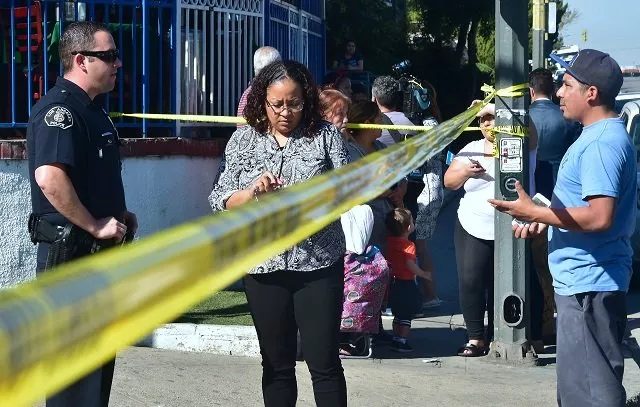 parents communicate with police officers at a roadblock to salvadore castro middle school in los angeles california on february 1 2018 where two students were wounded one critically in a school shooting local news agency cns reported that a quot young woman quot possibly a fellow student had been arrested photo afp parents communicate with police officers at a roadblock to salvadore castro middle school in los angeles california on february 1 2018 where two students were wounded one critically in a school shooting local news agency cns reported that a quot young woman quot possibly a fellow student had been arrested photo afp