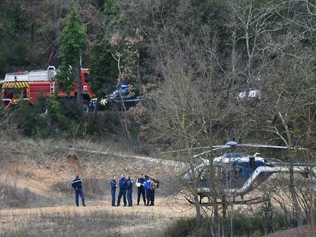 french police and firefighters at the site where two army helicopters collided and crashed in southern france on friday killing five officers photo afp