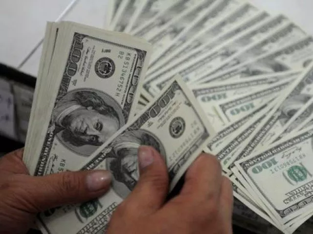 people are converting their savings into the greenback to ward off impact of further rupee depreciation photo afp people are converting their savings into the greenback to ward off impact of further rupee depreciation photo afp
