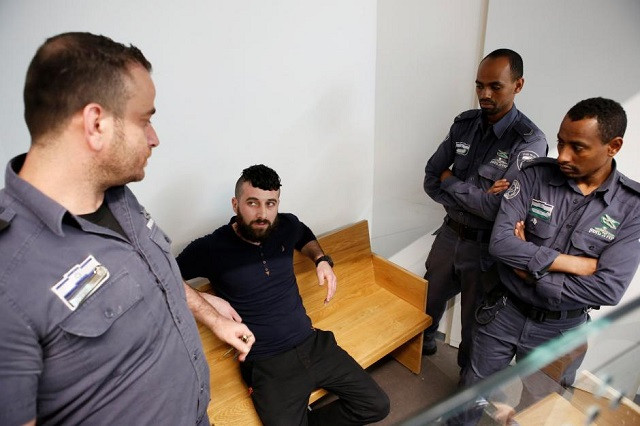 mohammed harouf a palestinian who pleaded guilty to the murder of a pregnant jewish settler sits in court accompanied by israeli prison authority guards in tel aviv israel february 4 2018 photo reuters