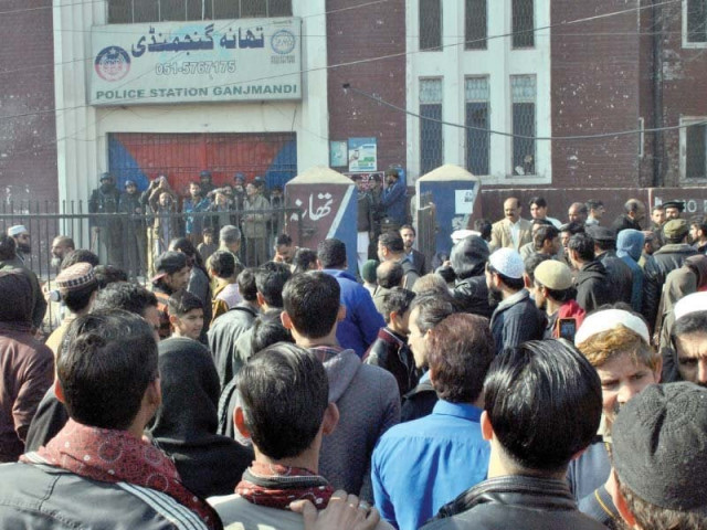 people protesting outside ganjmandi police station rawalpindi against the alleged custodial death of a suspect photo agha mehroz express people protesting outside ganjmandi police station rawalpindi against the alleged custodial death of a suspect photo agha mehroz express