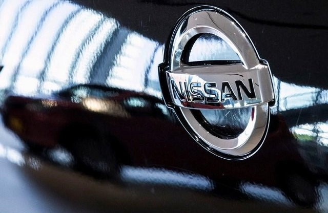 a car is reflected in the bonnet of a nissan car in the showroom at nissan 039 s global headquarters in yokohama south of tokyo february 9 2015 photo reuters