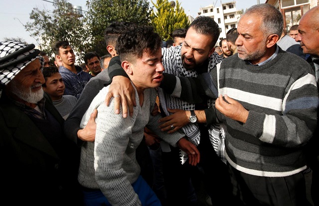 relatives of palestinian assailant react outside his house near hebron in occupied west bank february 7 2018 photo reuters