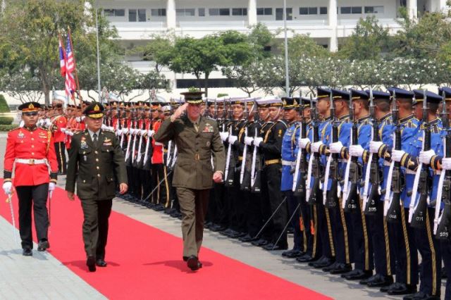 us general joe dunford c salutes as he inspects a thai honour guard alongside his thai counterpart general tarnchaiyan srisuwan 2nd l photo afp thomas watkins