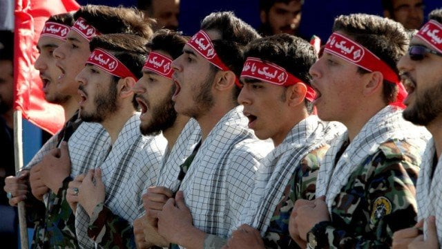 iranian members of the basij militia march during a parade marking the country s army day on april 18 2017 in tehran photo afp