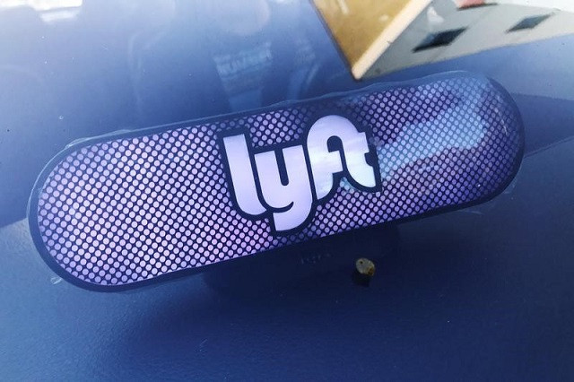 an illuminated sign appears in a lyft ride hailing car in los angeles california us september 21 2017 picture taken september 21 2017 photo reuters