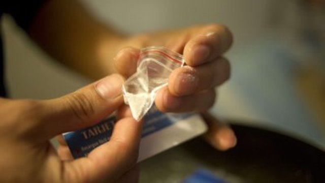 a drug dealer prepares cocaine for street sale photo afp