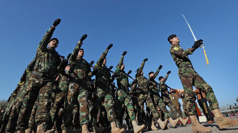 some four hundred eighteen male and female peshmerga fighters completed their military training and graduated from the academy afp photo safin hamed