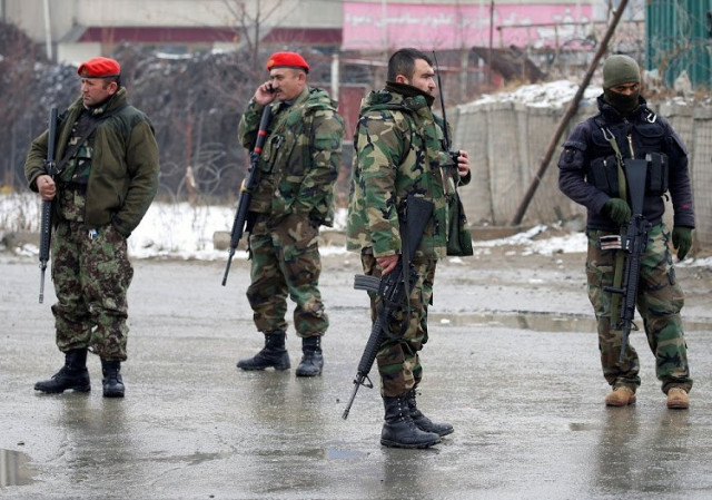 afghan national army ana soldiers stand guard at the entrance gate of marshal fahim military academy in kabul afghanistan photo reuters