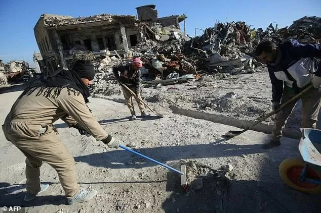 workers clean up debris from a street in mosul 039 s old city on january 8 2018 six months after iraqi forces seized the country 039 s second city from islamic state group jihadists photo afp workers clean up debris from a street in mosul 039 s old city on january 8 2018 six months after iraqi forces seized the country 039 s second city from islamic state group jihadists photo afp