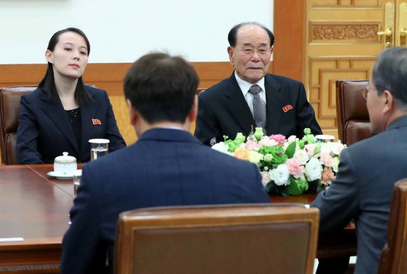 south korea 039 s president moon jae in far r back to camera talks with kim yo jong l north korean leader kim jong un 039 s sister and north korea 039 s ceremonial head of state kim yong nam 2nd r facing during their meeting at the presidential blue house in seoul photo afp