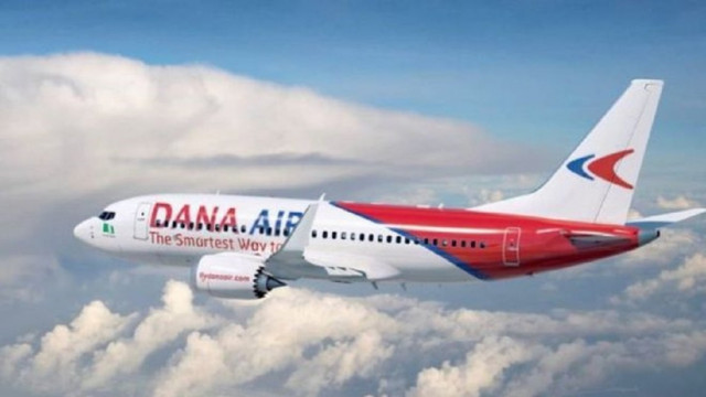 emergency door falls of a dana air 039 s plane door shortly after landing photo dana air emergency door falls of a dana air 039 s plane door shortly after landing photo dana air
