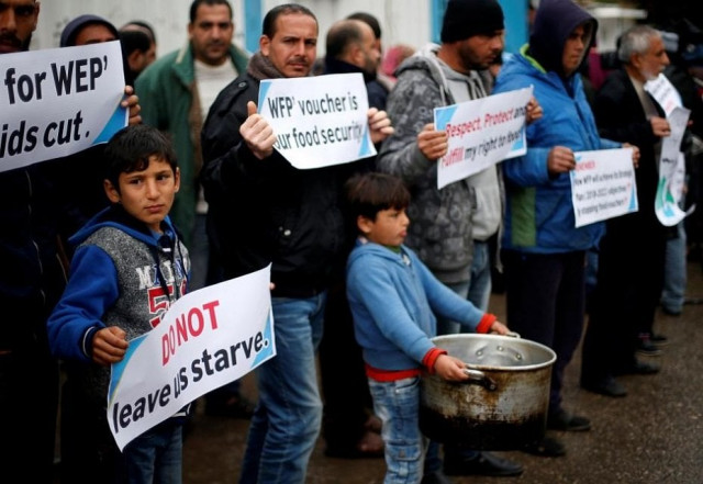 palestinians hold signs during a protest against aid cut outside united nations 039 offices in gaza city january 17 2018 photo reuters palestinians hold signs during a protest against aid cut outside united nations 039 offices in gaza city january 17 2018 photo reuters
