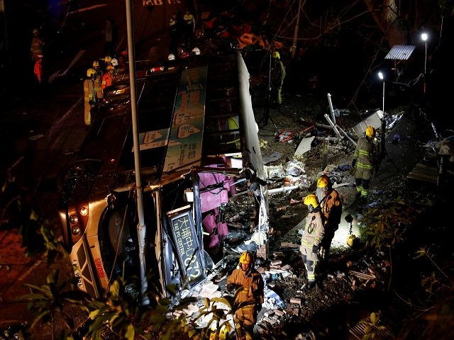 rescuers walk beside a crashed bus in hong kong china february 10 2018 photo reuters rescuers walk beside a crashed bus in hong kong china february 10 2018 photo reuters