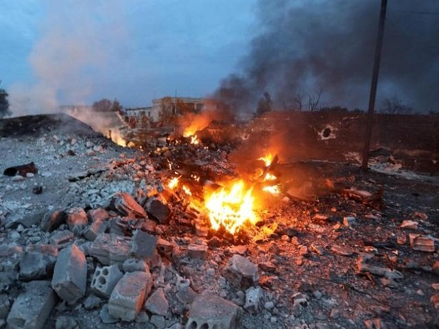 the burning remains of the downed fighter jet picture photo afp