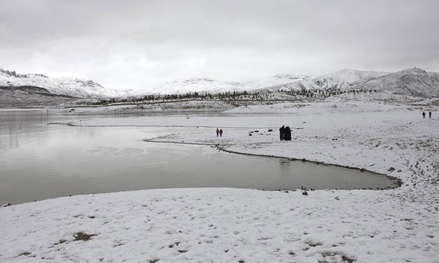 a general view of people visiting the snow covered hanna lake before it ran dry photo reuters