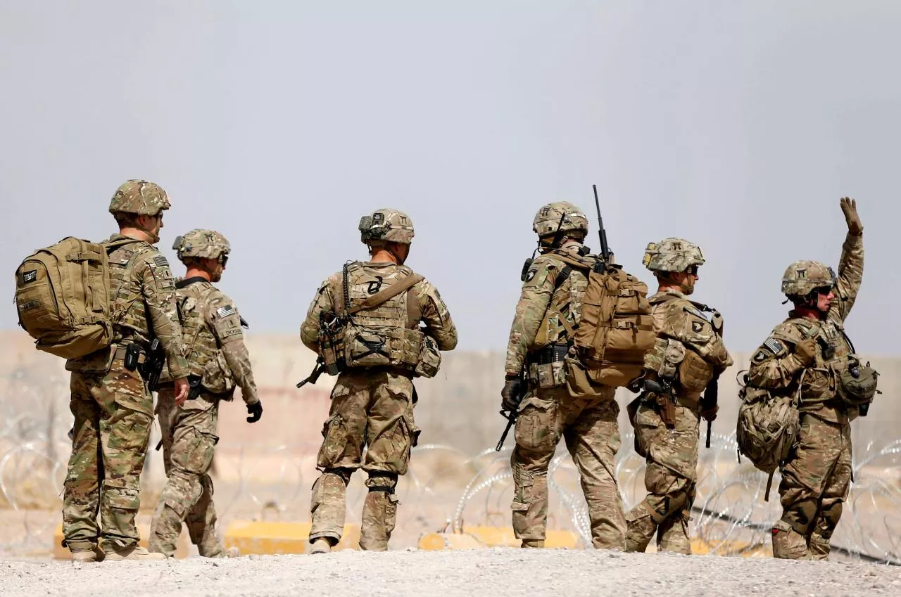 us troops walk outside their base in uruzgan province afghanistan photo reuters us troops walk outside their base in uruzgan province afghanistan photo reuters