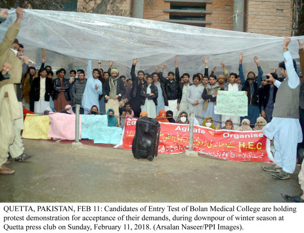 students protesting during downpour outside the quetta press club photo ppi students protesting during downpour outside the quetta press club photo ppi
