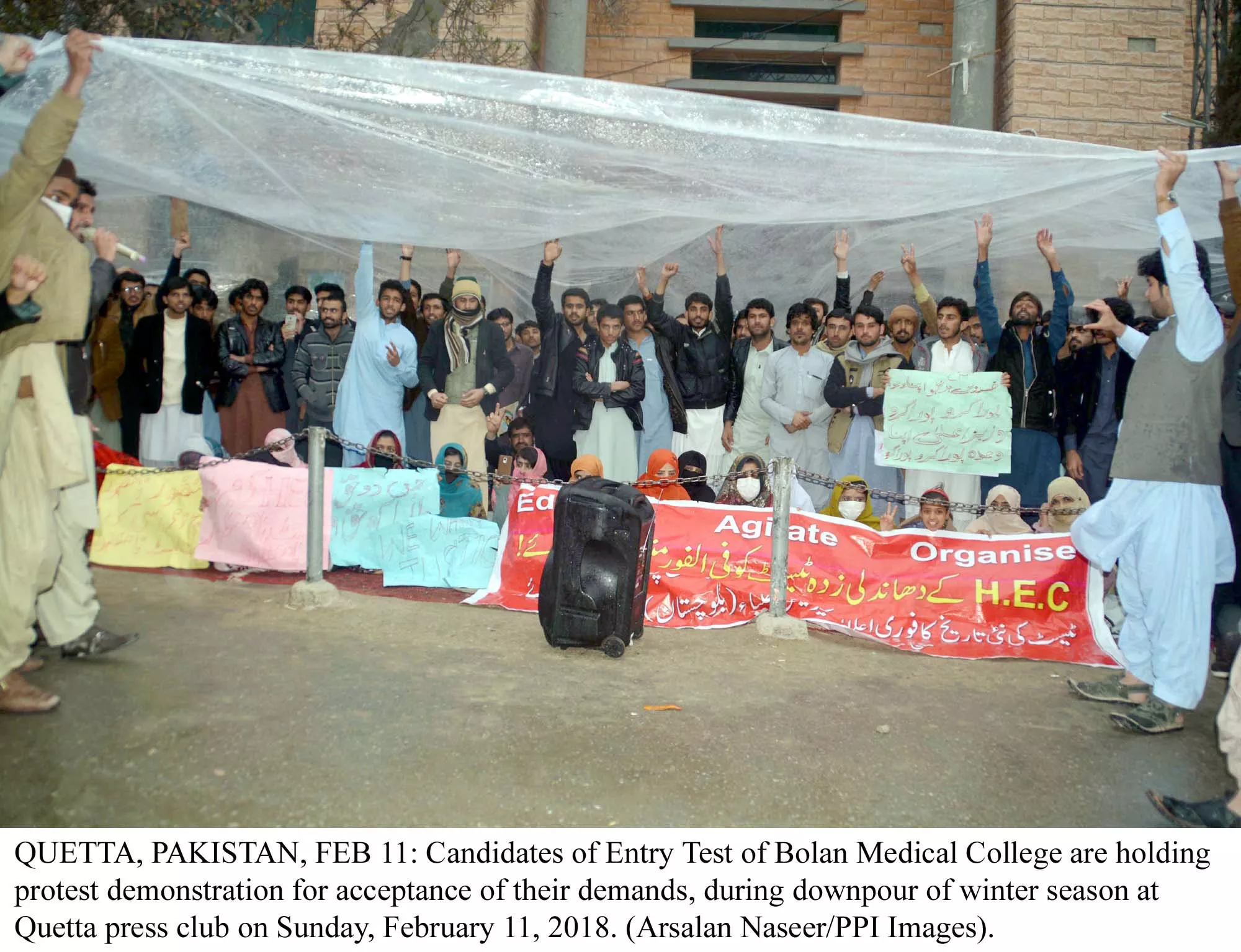students protesting during downpour outside the quetta press club photo ppi students protesting during downpour outside the quetta press club photo ppi