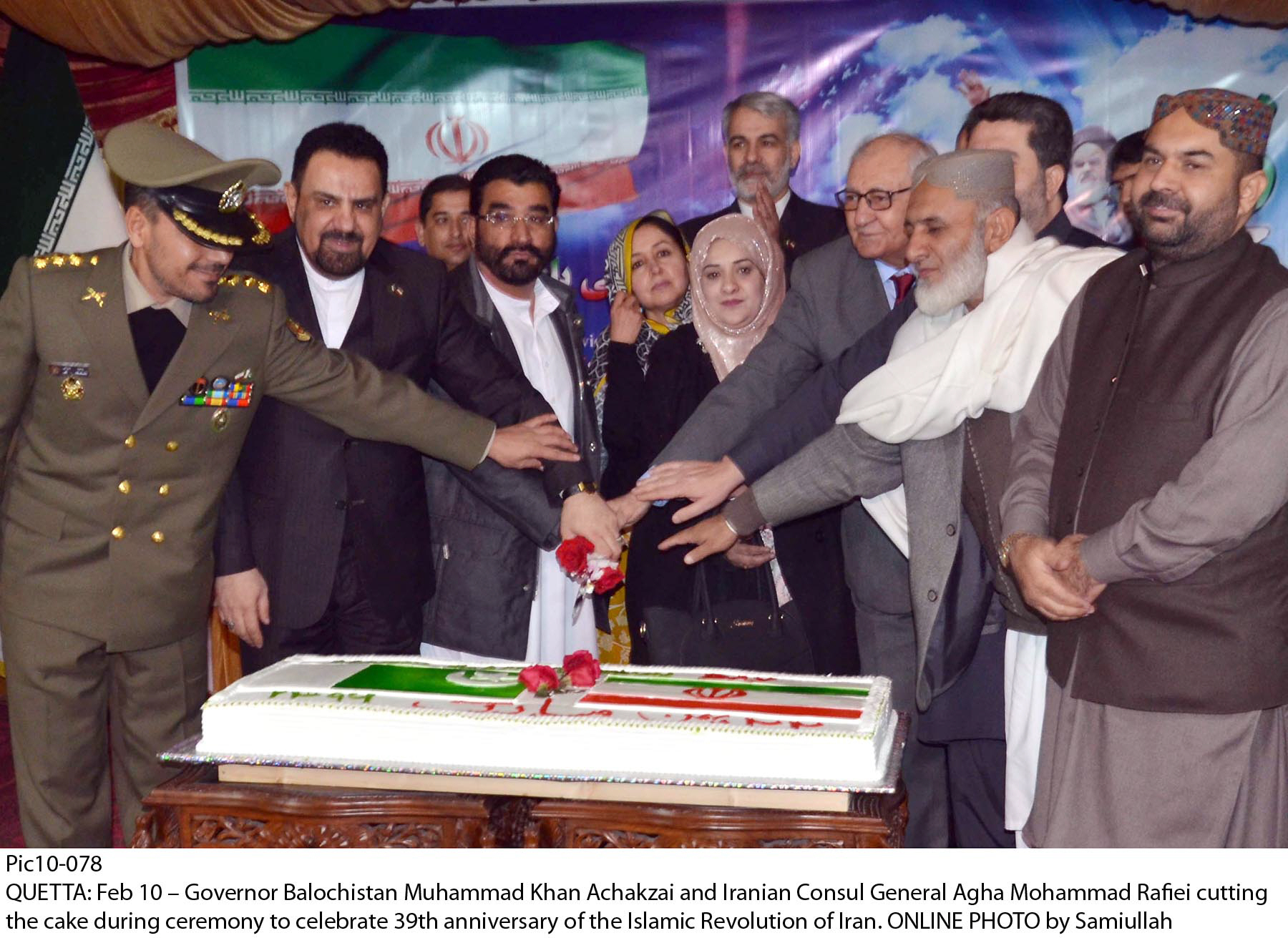 balochistan governor mohammad khan achakzai and iranian consul general agha mohammad rafiei along with others cut a cake during a ceremony to celebrate the 39th anniversary of the islamic revolution in iran photo online