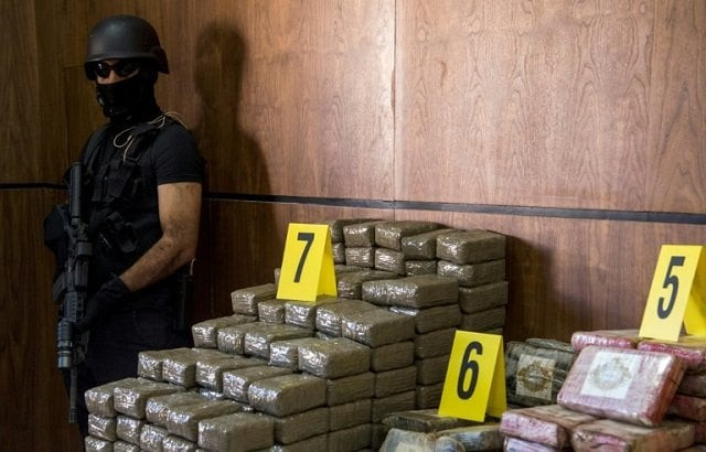 seized drugs and weapons are displayed by morocco 039 s central bureau of criminal investigation in marrakesh on october 4 2017 photo afp seized drugs and weapons are displayed by morocco 039 s central bureau of criminal investigation in marrakesh on october 4 2017 photo afp