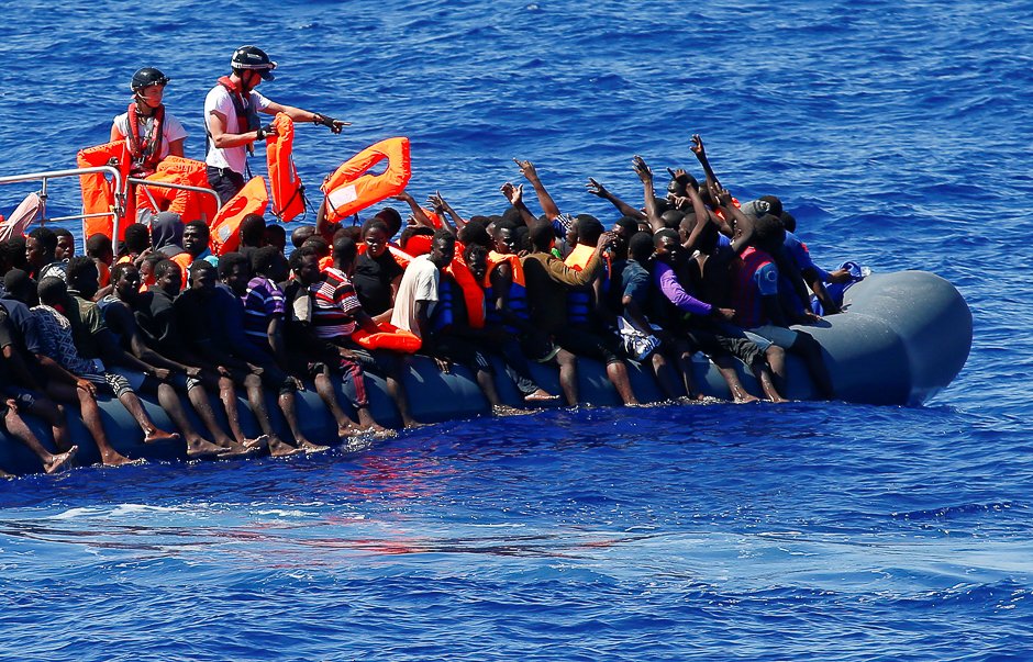 migrants on a rubber boat are rescued by sos mediterranee organisation during a search and rescue sar operation with the mv aquarius rescue ship not pictured in the mediterranean sea off the libyan coast photo reuters