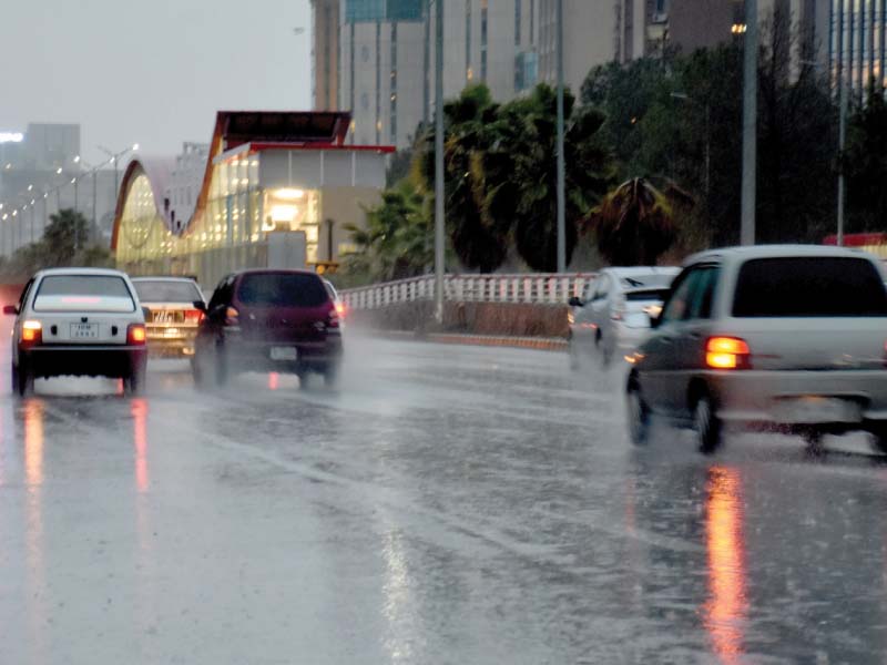 traffic moves on during rain photo express