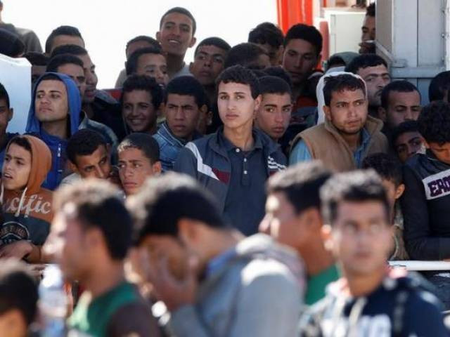 migrants disembark from the italian coastguard vessel peluso in the sicilian harbour of augusta italy