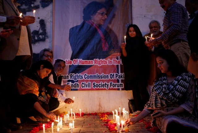 civil society members lighting candles at a vigil organised in memory of human rights activist and lawyer asma jahangir outside the karachi press club photo reuters civil society members lighting candles at a vigil organised in memory of human rights activist and lawyer asma jahangir outside the karachi press club photo reuters
