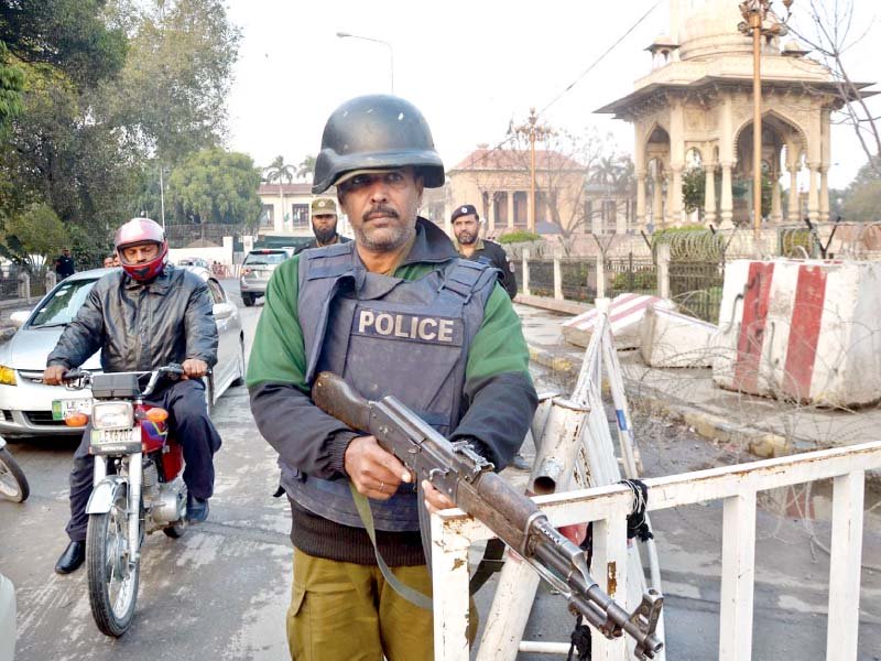 a policeman stands alert outside punjab assembly photo online