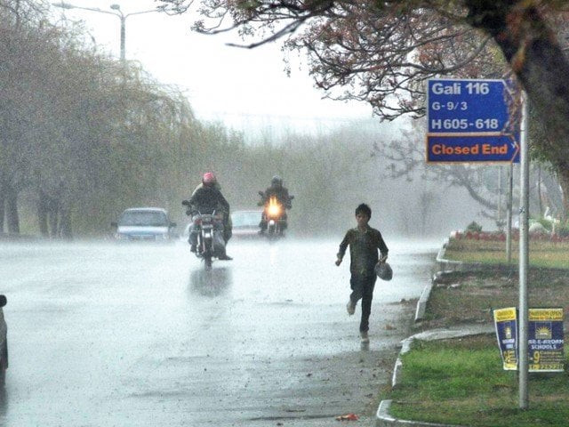 a boy racing home during the rain photo app file a boy racing home during the rain photo app file