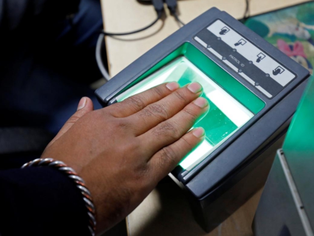 a woman goes through the process of finger scanning for the unique identification uid database system also known as aadhaar at a registration centre in new delhi photo reuters