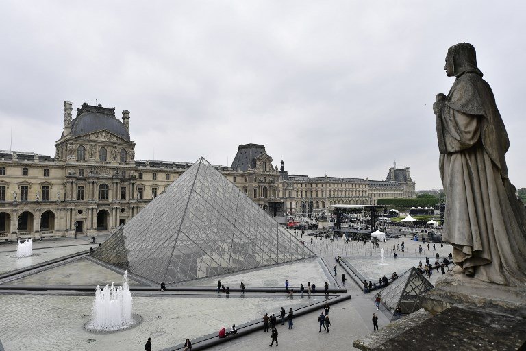 a general view shows the stage set up by france 039 s en marche movement at the pyramid of the louvre museum photo afp