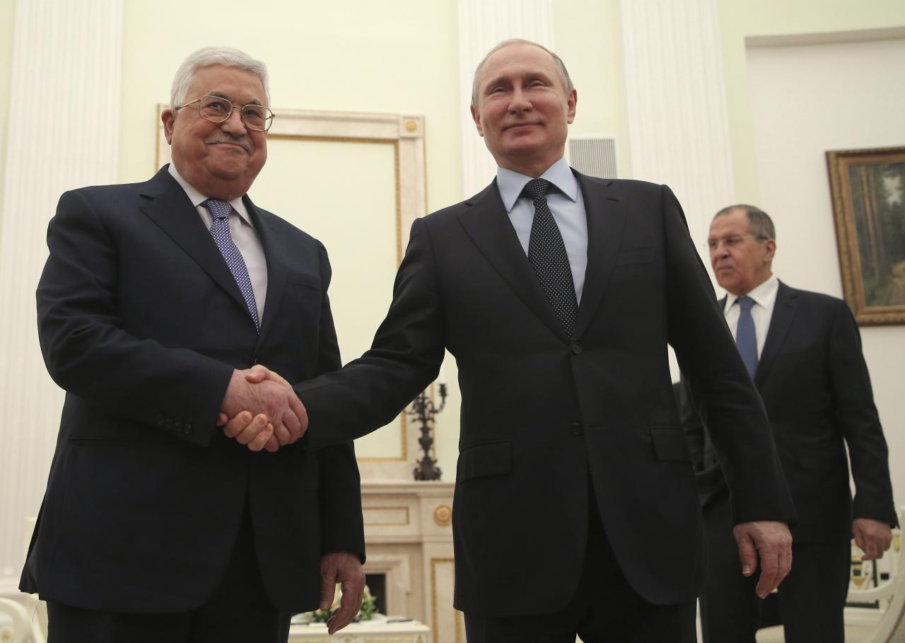 russian president vladimir putin c foreign minister sergei lavrov r and palestinian president mahmoud abbas attend a meeting at the kremlin in moscow russia february 12 2018 photo reuters
