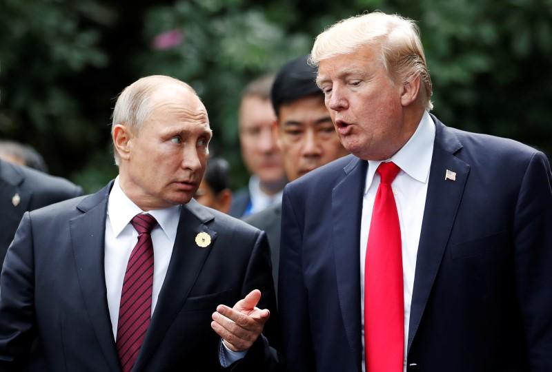 us president donald trump and russia 039 s president vladimir putin talk during the family photo session at the apec summit in danang vietnam photo reuters