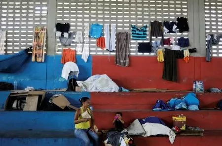 venezuelan woman and her child sit at a gym which has turned into a shelter for venezuelans and is run by civil defense with meals provided by evangelical churches in caimbe neighbourhood in boa vista roraima state brazil photo reuters venezuelan woman and her child sit at a gym which has turned into a shelter for venezuelans and is run by civil defense with meals provided by evangelical churches in caimbe neighbourhood in boa vista roraima state brazil photo reuters