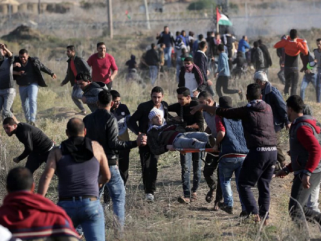 palestinian protesters carry a wounded young during a protest against us president decision to recognize jerusalem as the capital of israel during clashes along the border between israel and east gaza photo afp