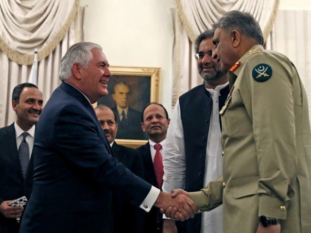 secretary of state rex tillerson shakes hands with pakistan s chief of army staff qamar javed bajwa next to pakistani prime minister shahid khaqan abbasi in islamabad in october photo afp
