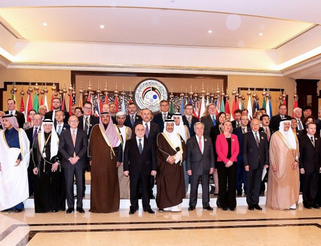 kuwaiti foreign minister sheikh sabah al khaled al sabah c stands next to iraq prime minister haider al abadi eu foreign policy chief frederica mogherini un secretary general antonio guterres as they pose with other officials for a group photo on the second day of an international conference for reconstruction of iraq in kuwait city on february 14 2018 photo afp kuwaiti foreign minister sheikh sabah al khaled al sabah c stands next to iraq prime minister haider al abadi eu foreign policy chief frederica mogherini un secretary general antonio guterres as they pose with other officials for a group photo on the second day of an international conference for reconstruction of iraq in kuwait city on february 14 2018 photo afp