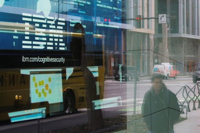 pedestrians pass a video advertisement for ibm at their office in cambridge massachusetts us january 16 2018 photo reuters pedestrians pass a video advertisement for ibm at their office in cambridge massachusetts us january 16 2018 photo reuters