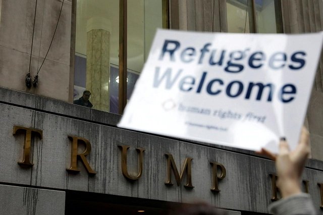 protesters gather outside the trump building at 40 wall st to take action against america s refugee ban in new york city u s march 28 2017 photo reuters