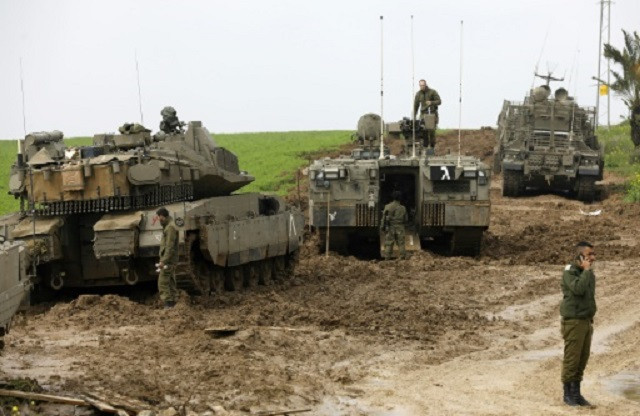 israeli soldiers monitor an area near the border with gaza on sunday photo afp israeli soldiers monitor an area near the border with gaza on sunday photo afp