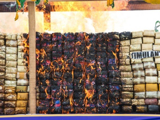 confiscated drugs are burnt during a ceremony by myanmar police to commemorate world anti drugs day on the outskirts of yangon on june 26 2017 photo afp