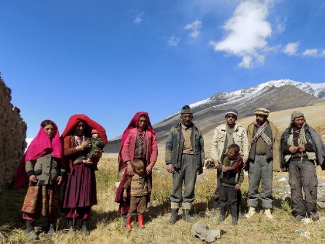 this photograph taken on october 8 2017 shows afghan wakhi nomad family posing for a picture in the wakhan corridor in afghanistan photo afp