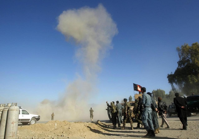 smoke rises in the sky after afghan security forces detonated an explosive device at the site of a blast in jalalabad city november 10 2014 photo reuters