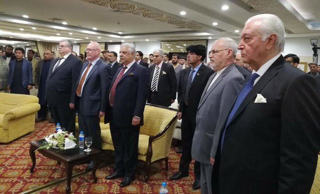 guests stand in honor of the national anthems of russia and pakistan at the inaugural ceremony photo courtesy arab news