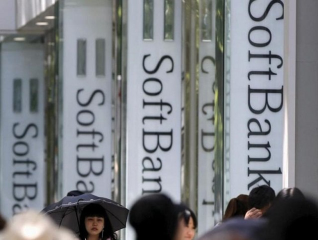 pedestrians walk past logos of softbank corp in front of its branch in tokyo may 11 2015 photo reuters pedestrians walk past logos of softbank corp in front of its branch in tokyo may 11 2015 photo reuters
