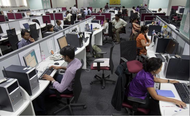 workers are seen at their workstations on the floor of an outsourcing centre in bangalore february 29 2012 photo reuters