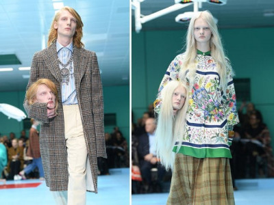 gucci models carry replicas of heads at milan fashion week