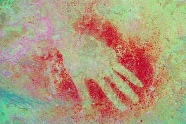 a prehistoric hand painting on a wall of the quot paintings hall quot in the maltravieso cave in caceres photo afp a prehistoric hand painting on a wall of the quot paintings hall quot in the maltravieso cave in caceres photo afp